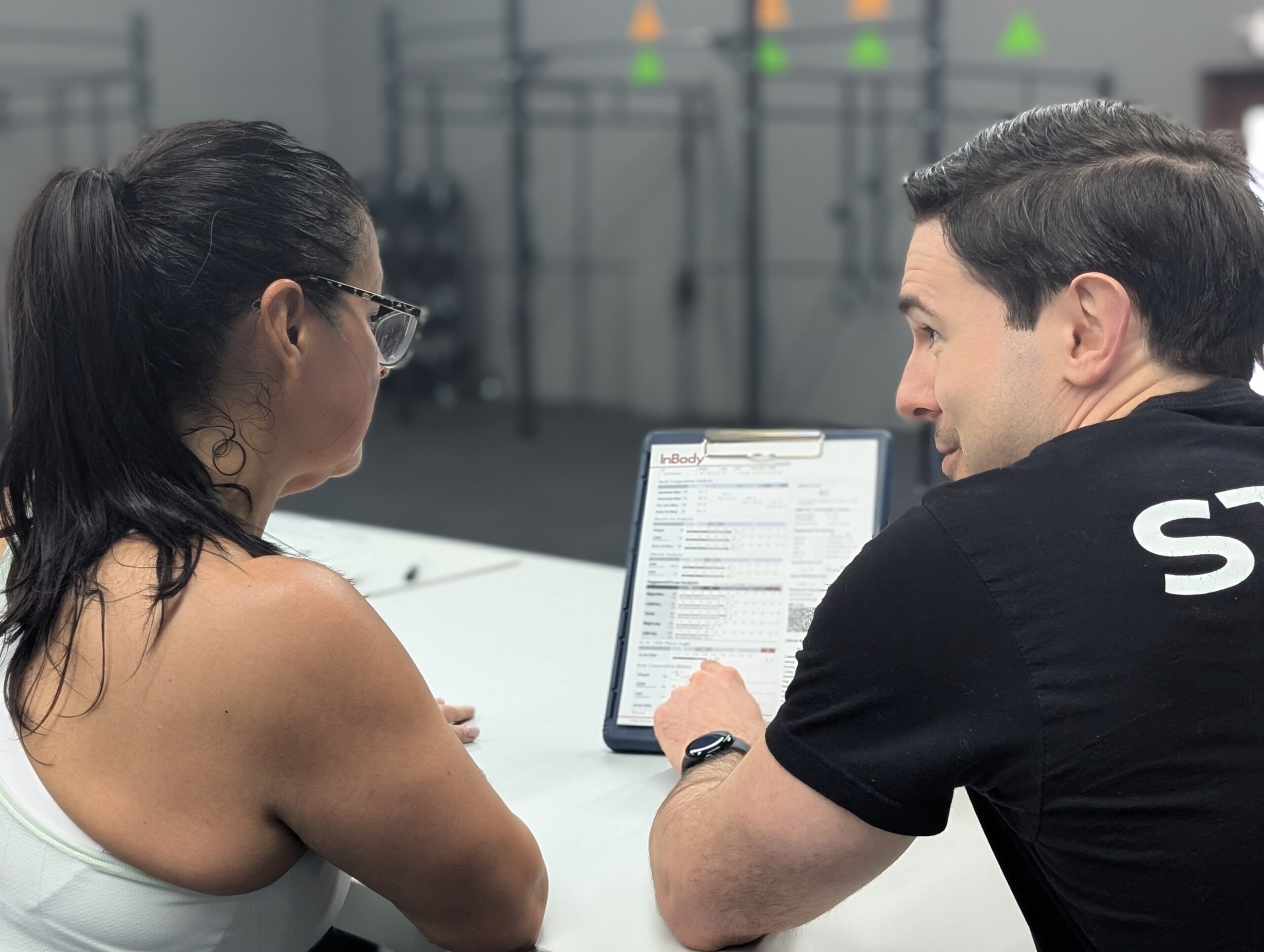Coach reviewing progress with a client